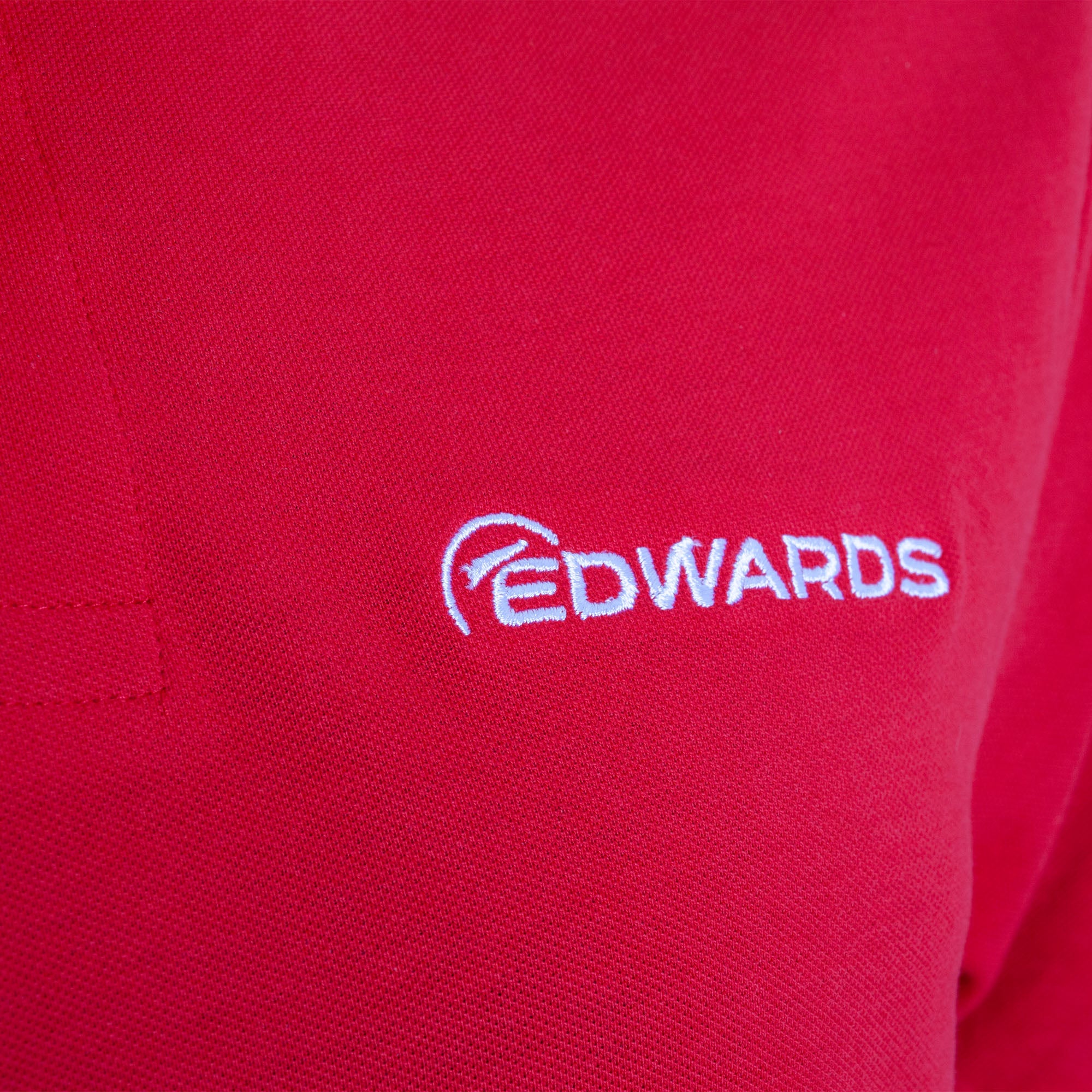 red edwards polo with white logo close up 